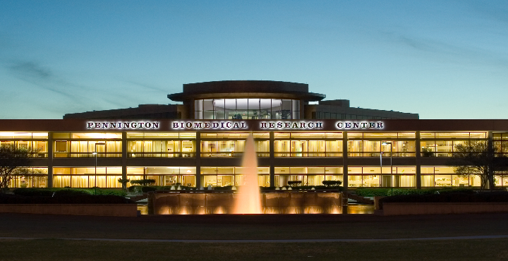Facade of Pennington Biomedical Research Center at dusk